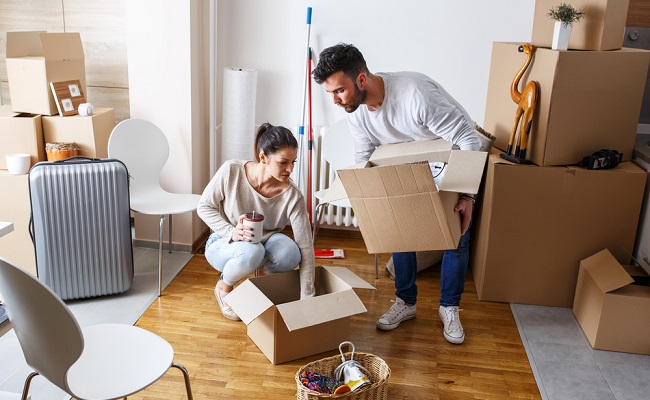 couple packing boxes move